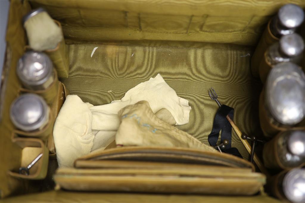 A late Victorian crocodile skin travelling toilet case